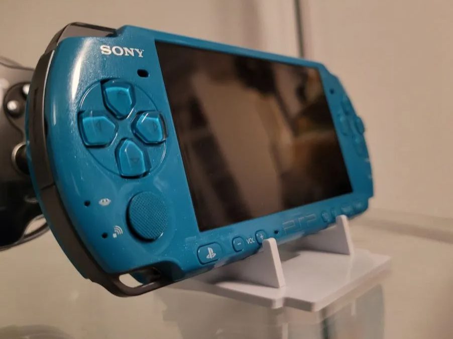 Universal stand for handheld consoles and CD / DVD — vue 1